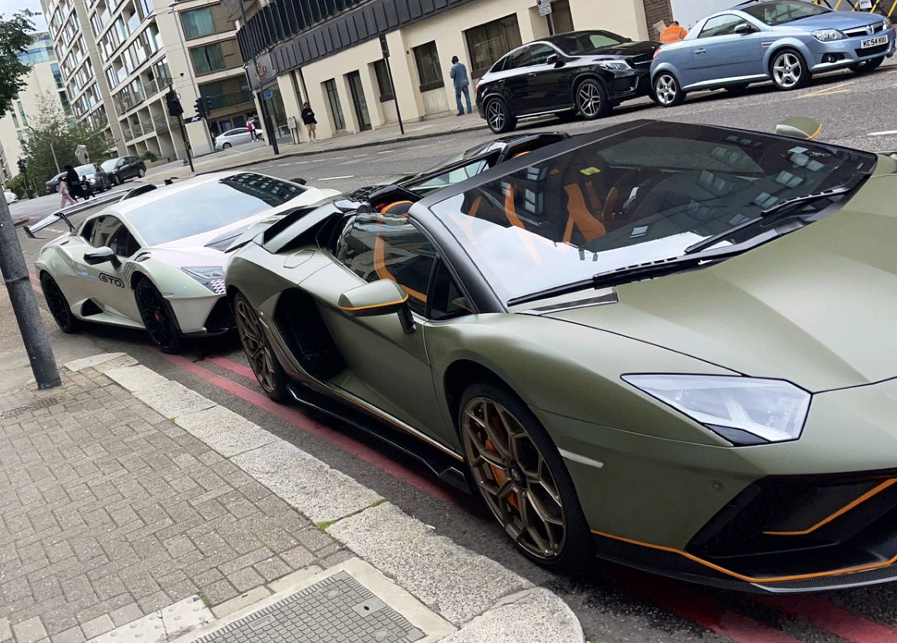 Two Aventador Ultimaes: parked on Holland Road at Kensington's Car Wash