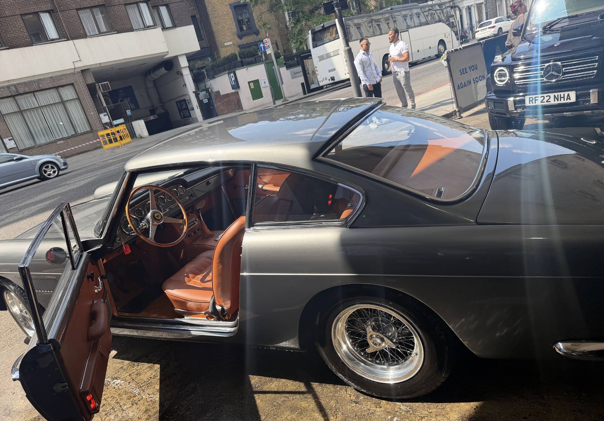 Classic Ferrari 250 GT interior: orange leather, top down at Kensington's Car Wash